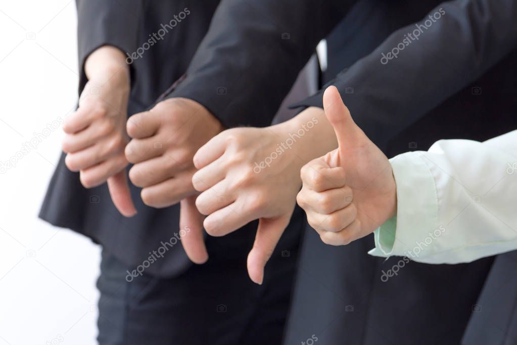Group of Business show dislike or unlike thumbs down hand