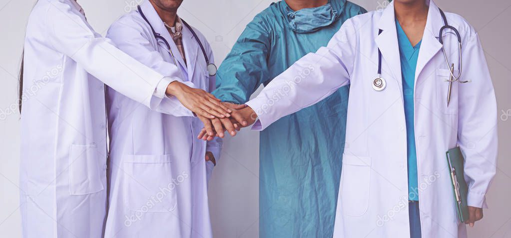 Doctors and Nurses coordinate hands. Concept Teamwork