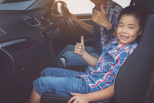 Happy family on a road trip, in car