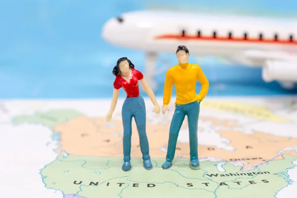 Miniature people, Couple standing on map American