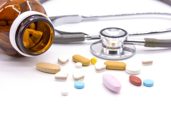 Difference tablets pills heap mix isolated on white background. 