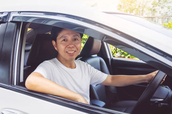 Asia man smile happy and drive car