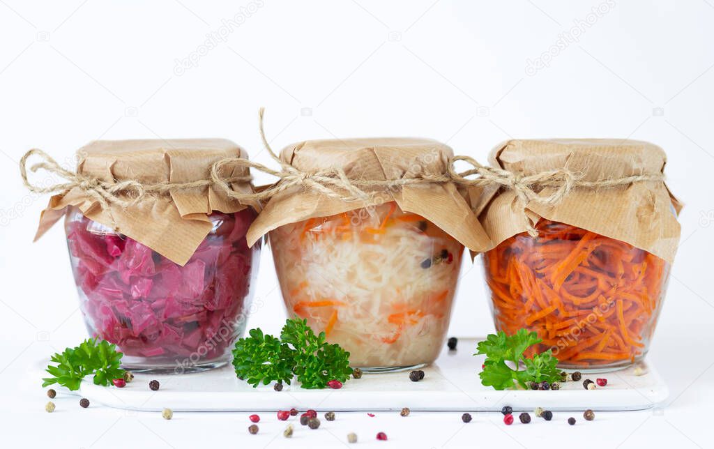 Pickled fermented vegetables in glass jars ready for eating