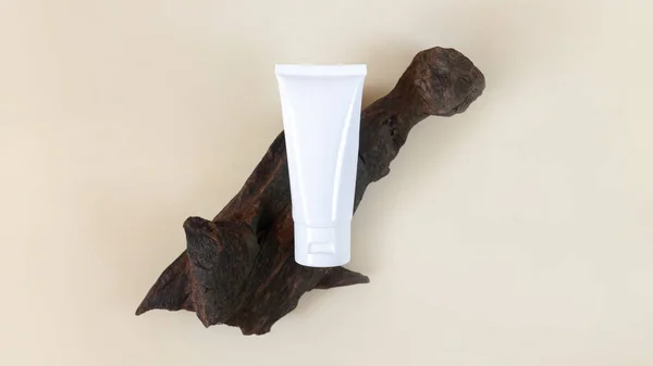 Blank white cosmetic tube for cream top view