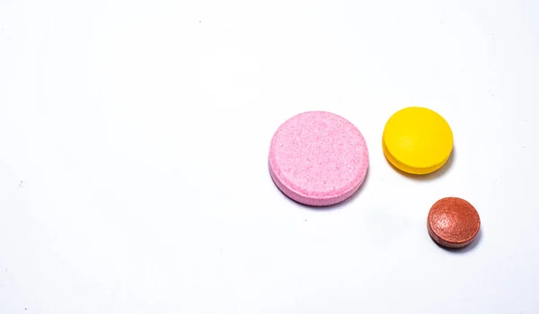 One White One Yellow One Brown Pill White Background — Stock Photo, Image