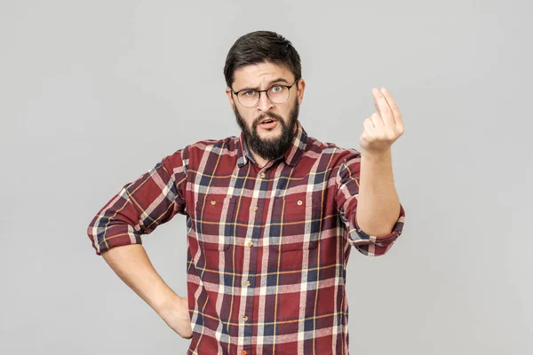 Handsome bearded man looking angry and showing Italian gesture — Stock Photo, Image