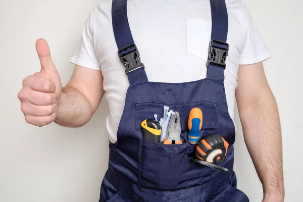 Construction worker with tools in his pocket — Stock Photo, Image