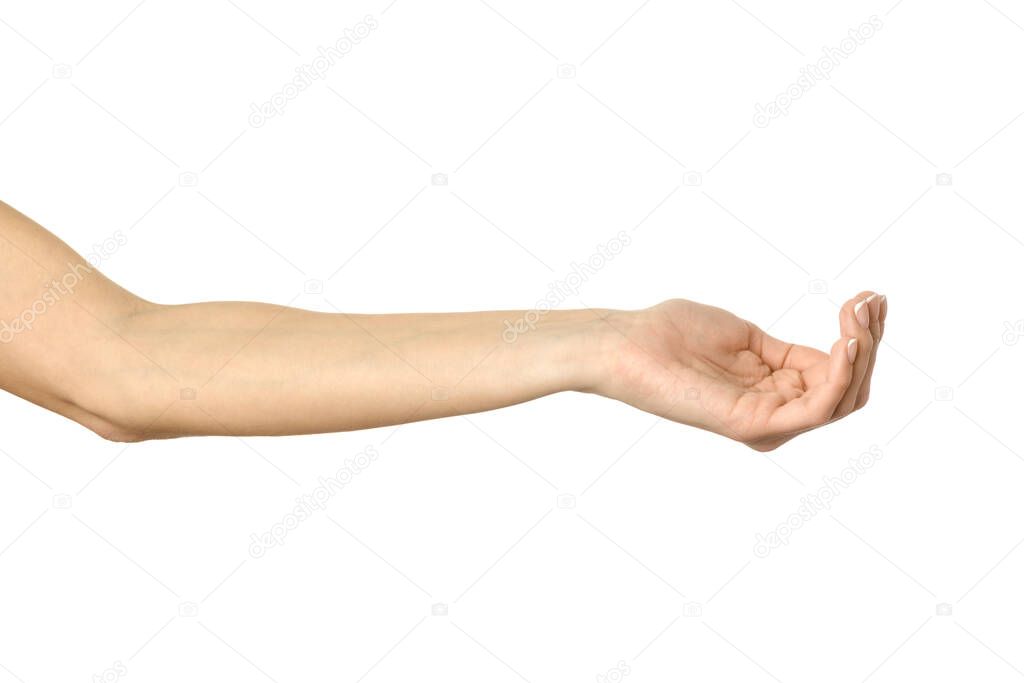 Outstretched female hand. Woman hand with french manicure gesturing isolated on white background. Part of series