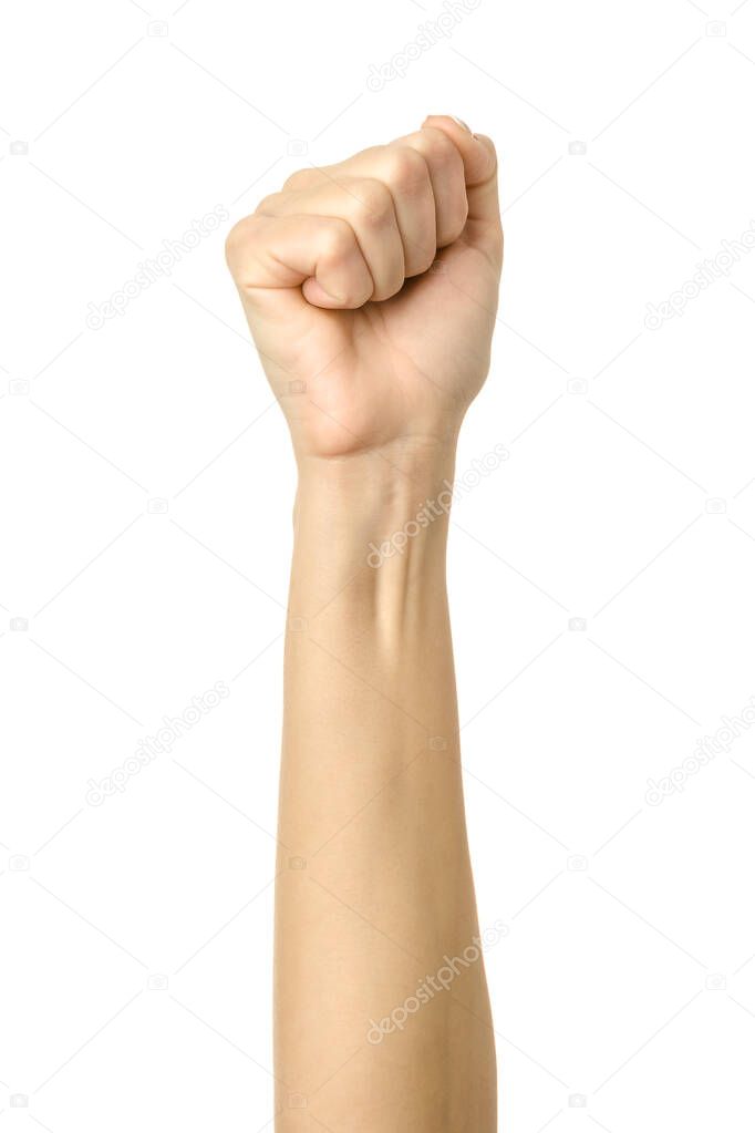 Hand clenched in a fist. Vertical image. Woman hand with french manicure gesturing isolated on white background. Part of series