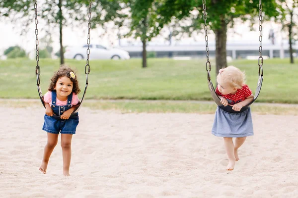 Portrait Two Happy Smiling Little Toddlers Girls Friends Swinging Swings — Stock Photo, Image