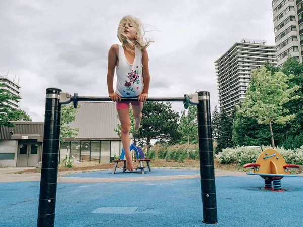 Cute Adorable Little Preschool Blonde Caucasian Girl Hanging Pullup Bar — Stock Photo, Image