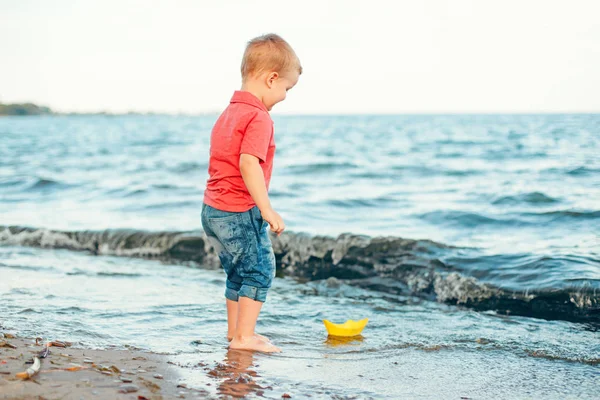 Happy Caucasian Red Haired Toddler Child Boy Putting Yellow Paper — Stock Photo, Image