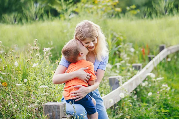 Young Blonde Caucasian Mother Boy Toddler Son Hugging Kissing Park — Stock Photo, Image