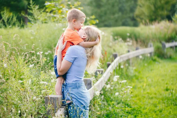 Young Blonde Caucasian Mother Boy Toddler Son Hugging Kissing Park — Stock Photo, Image