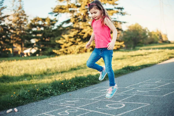 Cute Adorable Little Young Child Girl Playing Hopscotch Outdoor Funny — Stock Photo, Image