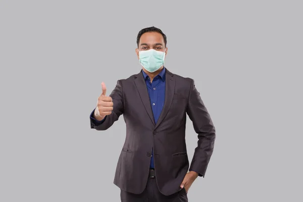 Businessman Showing Thump Up Wearing Medical Mask and Gloves Isolated. Indian Business Man Standing Thump Up sign