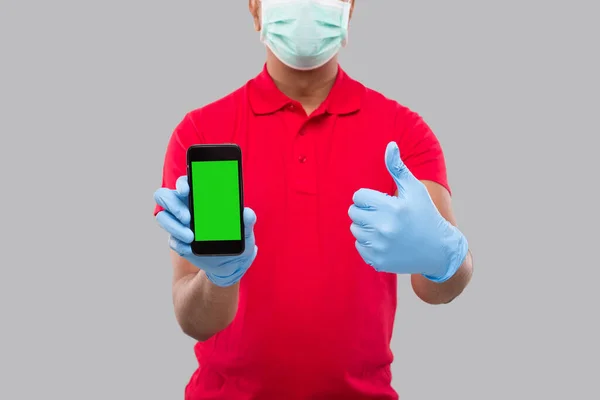 Indian Delivery Man Wearing Medical Mask Gloves Holding Phone Showing — Stock Photo, Image