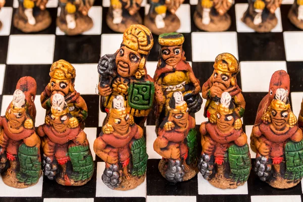 The traditional chess game art and craft product with Spanish against Inca people on a local handicraft market in Pisac, near Cusco, Peru