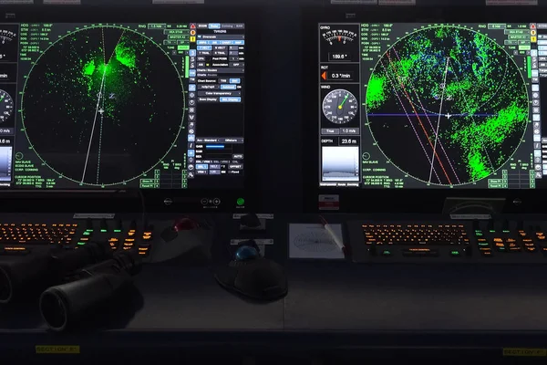 Ship control panel. a Navigational devices and echolocation and radar monitors.