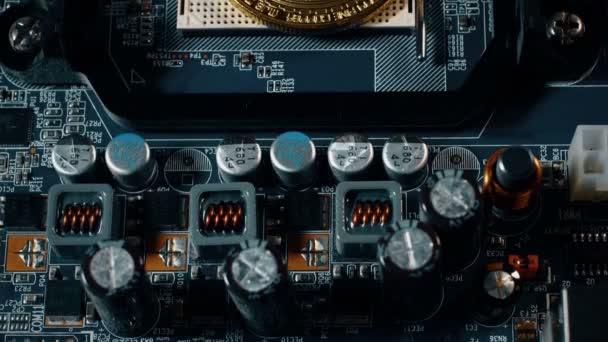 Crypto currency Gold Bitcoin - BTC - Bit Coin. Appearance of the bitcoin coin on the motherboard. — Stock Video