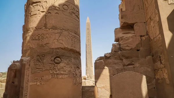 Karnak Temple in Luxor, Egypt. The Karnak Temple Complex, commonly known as Karnak, from Arabic Khurnak meaning fortified village , comprises a vast mix of decayed temples, chapels, pylons, and other buildings in Egypt. It is the second most visited