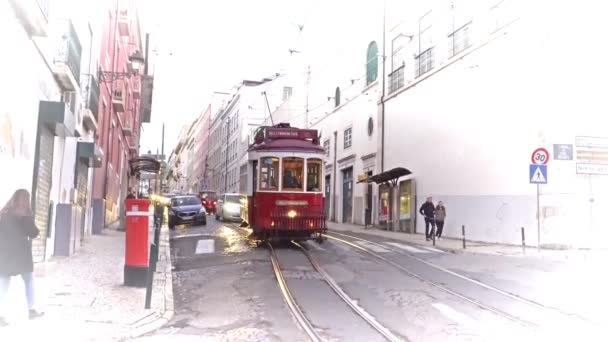 LISBON, circa 2017: Old tram passing by in the old town of Lisbon Portugal. Lisbon is the capital of Portugal. Lisbon is continental Europes capital city and the only one along the Atlantic coast. — Stock Video