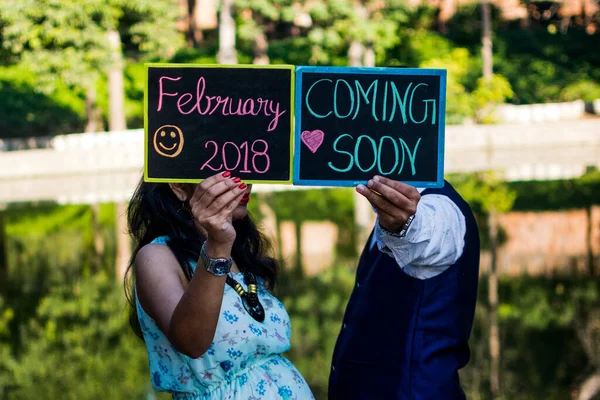 Maternity shoot pose for welcoming new born baby in Lodhi Road in Delhi India, Maternity photo shoot done by parents for welcoming their child during day time in Delhi