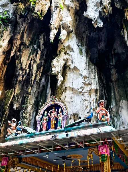 Beautiful natural limestone cave in Malaysia. Entrance to Dark Cave from a huge hollow feature. One of main caves located in Batu caves hill. Kuala Lumpur Malaysia
