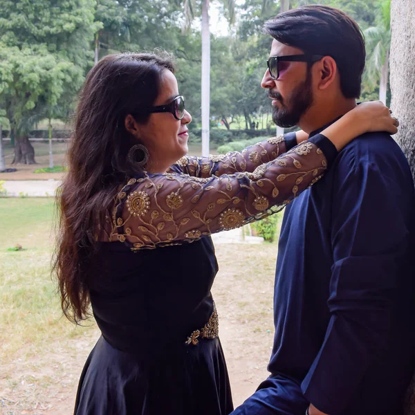 New Delhi India  November 25 2020 - A couple pose for Pre Wedding shoot inside Lodhi Garden Delhi, a popular tourist landmark in New Delhi India, for their pre wedding shoot, Pre-wedding photo shoot