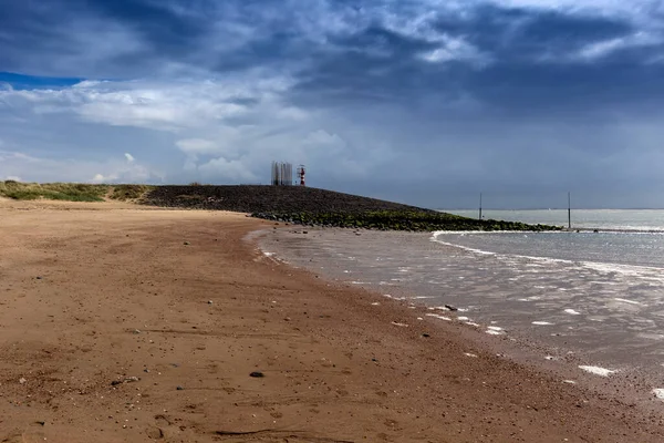 Vlissingen Beautiful Sandy Bay Lighthouse Small Rocky Hill Dramatic Clouds — Stock Photo, Image