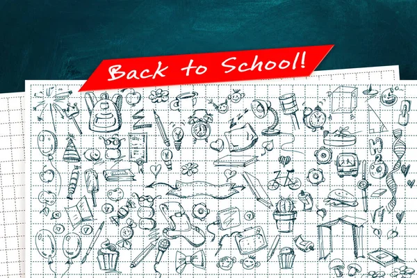 Back to school. Author\'s own creative drawings by hand with notebook sheets on the background of the school board. Creative poster or flyer