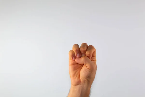 close up of a man\'s hand communicating with sign language, letters of the alphabet, on a white background