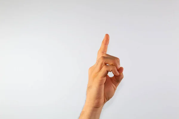 close up of a man\'s hand communicating with sign language, letters of the alphabet, on a white background