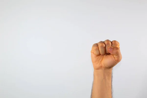 close up of a man\'s hand communicating with sign language, letters of the alphabet, on a white background