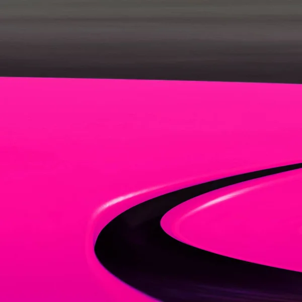 pair mirror image of two vivid bright pink shiny curve shaped tables transformed into e unique unusual shapes patterns and intricate designs