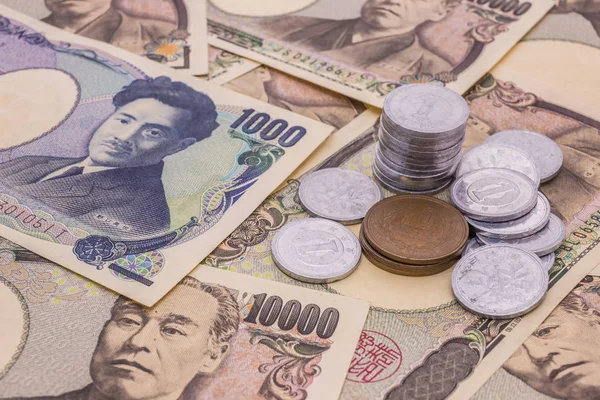 Tatlı Japon yeni banknot ve Japon yeni madeni para kavramı arka plan