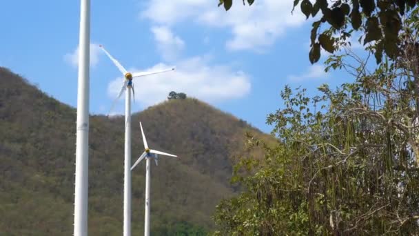 Wind turbines farm eco field in bright day with blue sky background at Chang Hua Man Royal Projects Phetchaburi Thailand. — 비디오