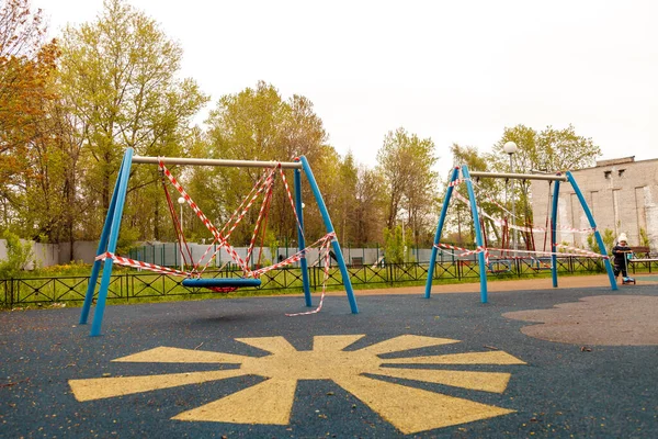 Children\'s Playground is closed due to pandemic, epidemic. Ban on children\'s playgrounds. Prevention of covid-19 coronavirus. Fight against virus. Self-isolation mode. Stay at home!