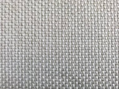 Gri kumaş dokusu. Seçici odak, yakın plan açık gri kumaş döşeme. Yünün lifli yapısı. Renkli tasarım. Metin kopyalamak için alanı olan duvar kağıdı ve arkaplan