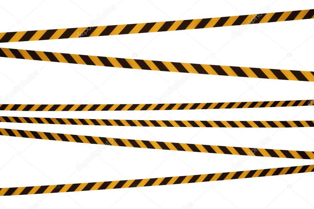 Black and yellow lines of barrier tape prohibit passage. Barrier tape on white isolate. Barrier that prohibits traffic. Warning tape. Danger unsafe area warning do not enter. Concept of no entry