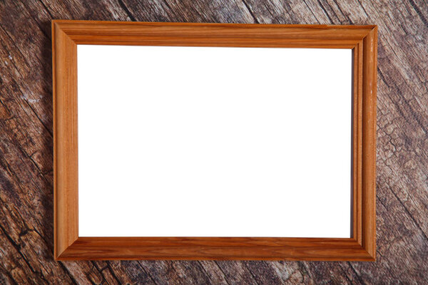 Empty boho style photo frame on wooden background. Isolated white light wood frame layout horizontal signage for artwork, lettering or logo. Copyright space for site