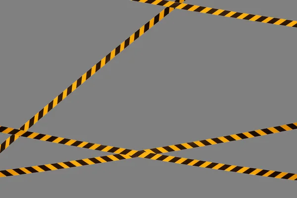 Black and yellow warning lines of barrier tape prohibit passage. Barrier tape on gray isolate. Barrier that prohibits traffic. Danger unsafe area warning do not enter. Concept of no entry. Copy space