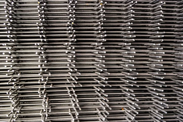 Stack of reinforcement mesh folded on each other view from the side — Stock Photo, Image