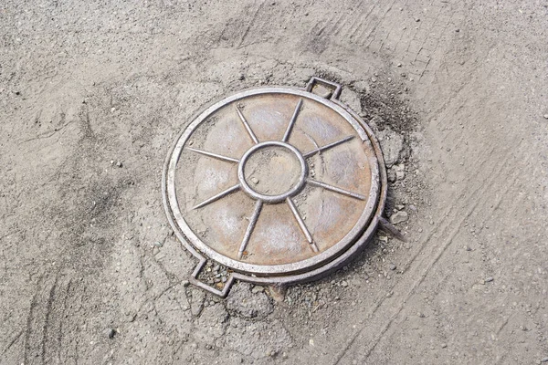 The lid of the sewer hatch, the hatch is closed Stock Picture