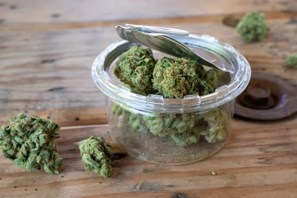 Cannabis Open Plastic Jar Pop Top Tin Lid — Stock Photo, Image