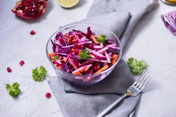 Healthy winter salad with red cabbage, carrot, beetroot, pomegranate, vitamin food