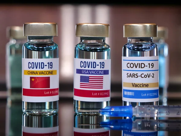 Three vials of vaccine covid-19. China, USA and SARS-CoV-2.