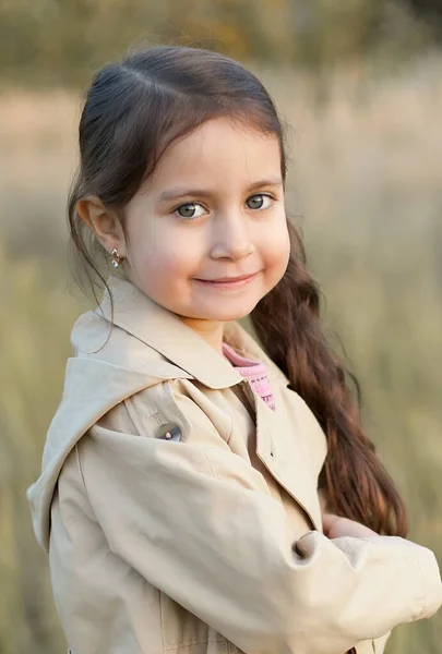 Cute Little Girl Yellow Jacket Beige Raincoat Walks Park Sunny — Stock Photo, Image