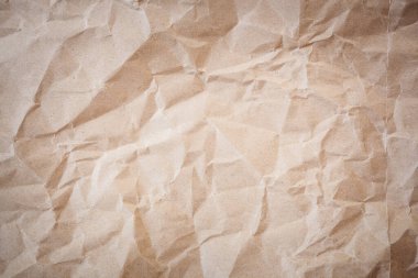 Kahverengi buruşuk kağıt doku arkaplanının yakınlaştırılması
