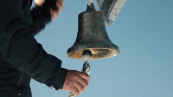 Closeup Hand Pulls Ships Bell — Stock Video